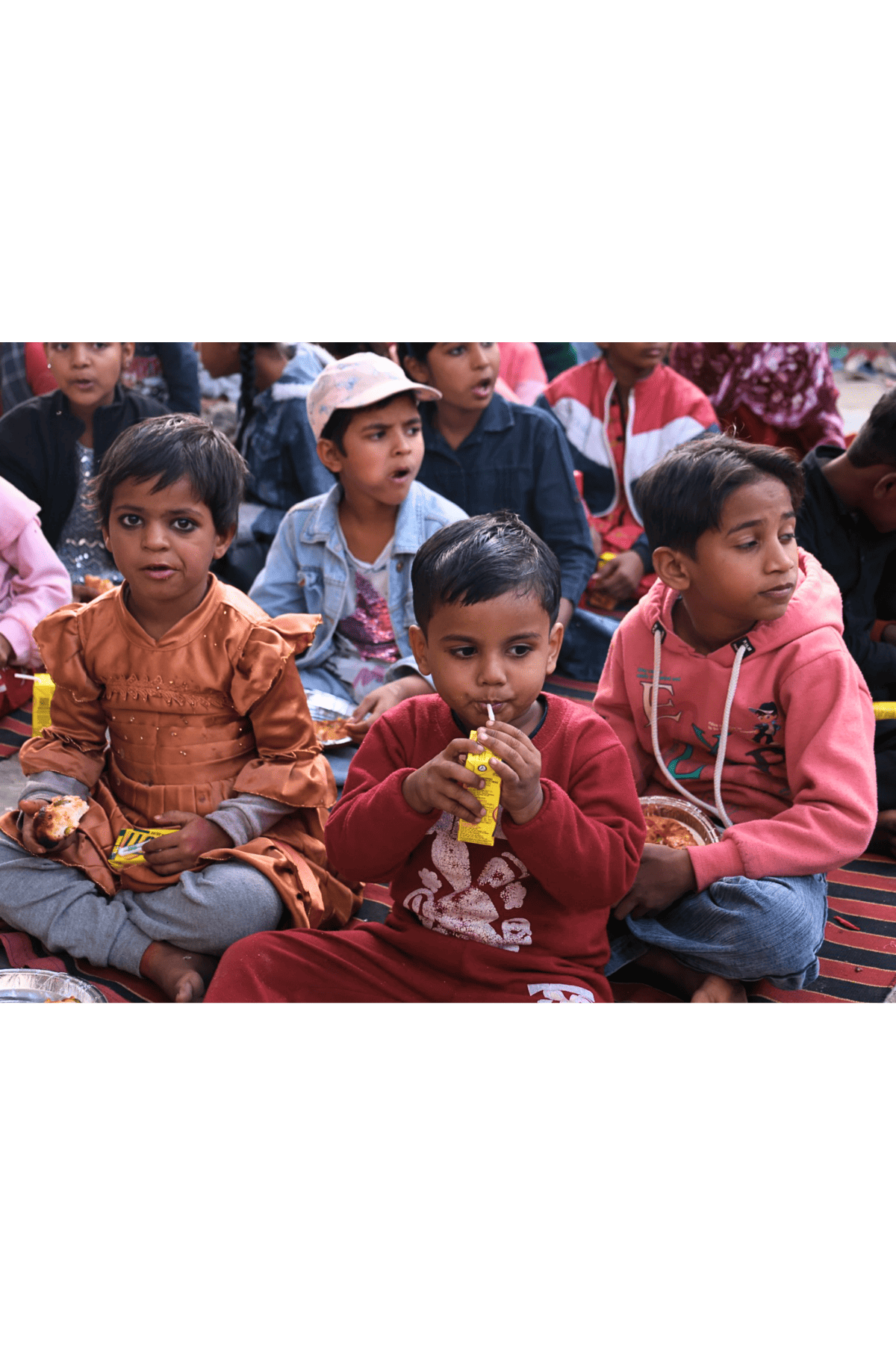 Children eating snacks together