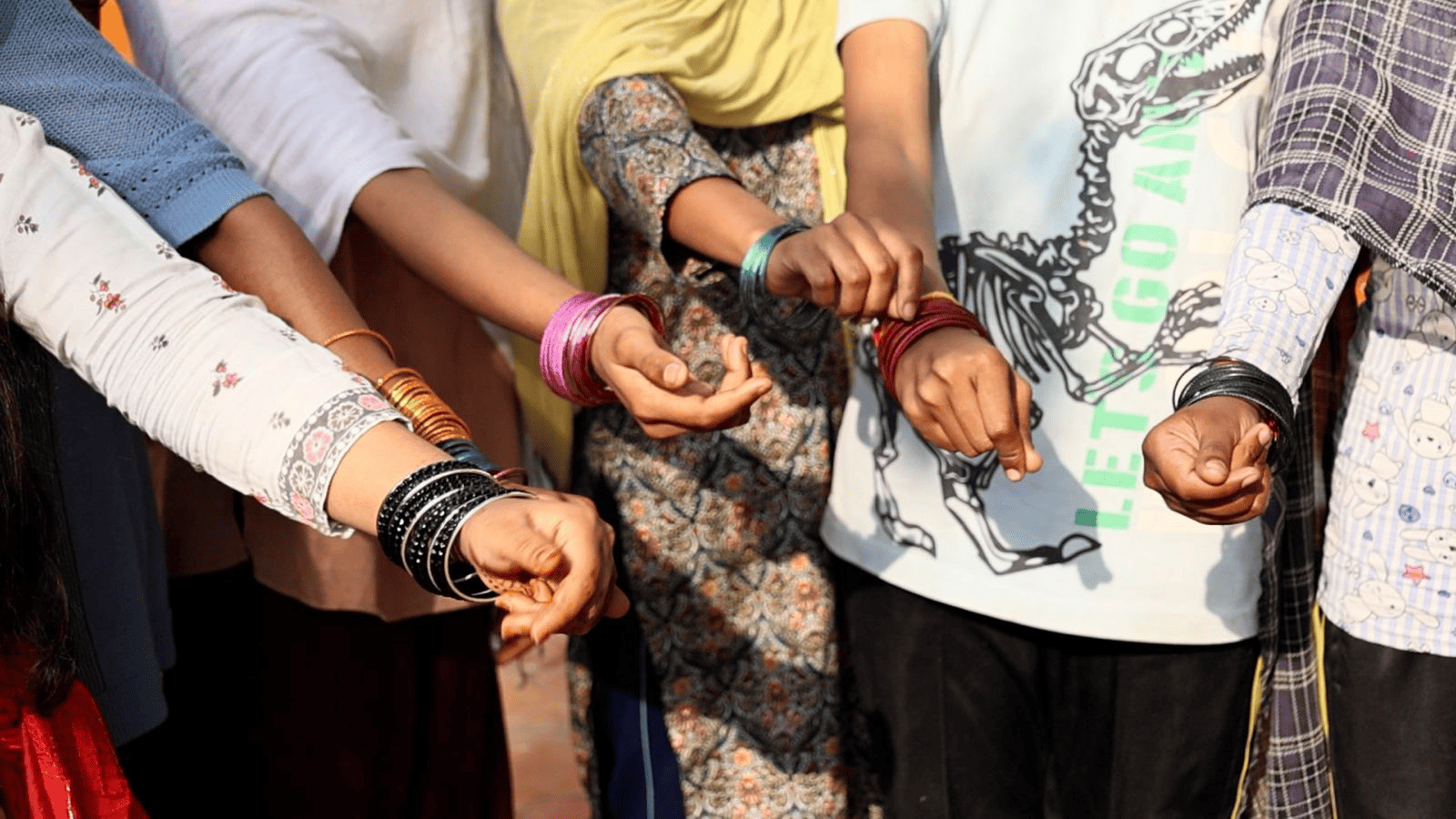 Children joining hands in unity