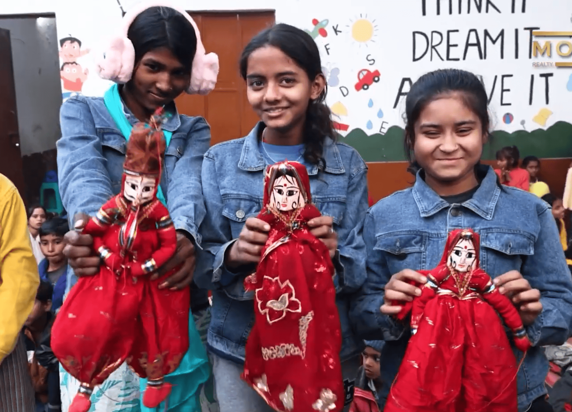 Children playing with puppets