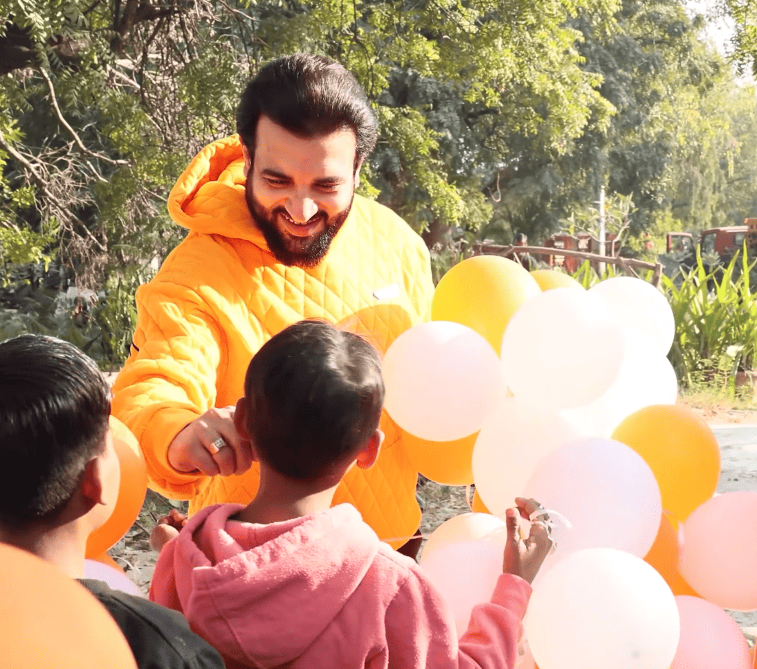 Founder with balloons and children