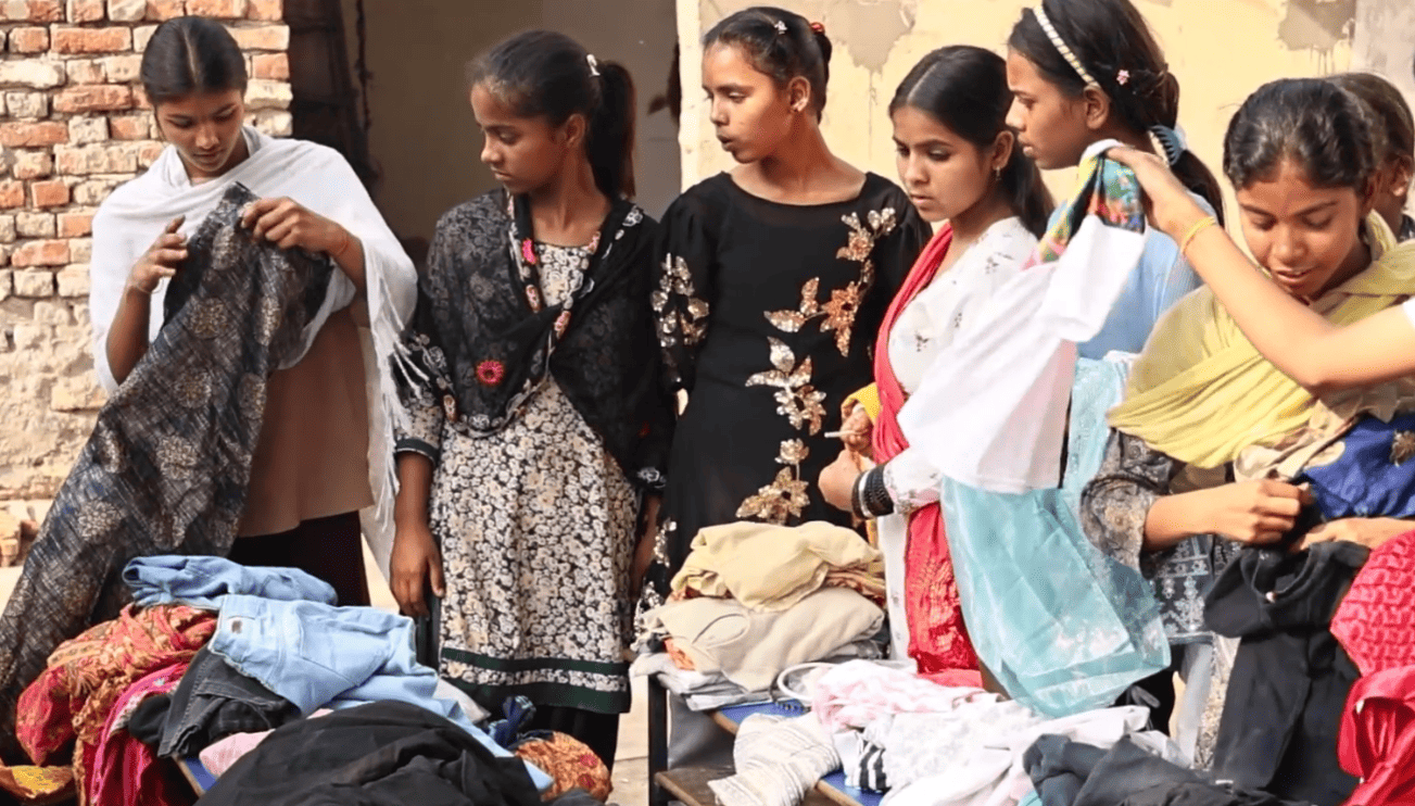 Girls selecting clothes